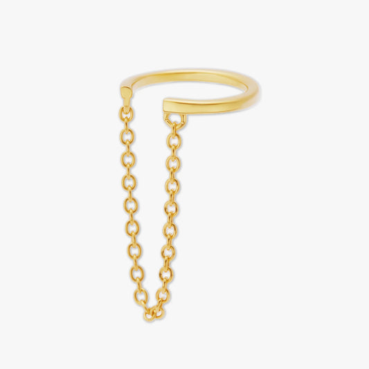 Gold ear cuff with a chain extension on a white background