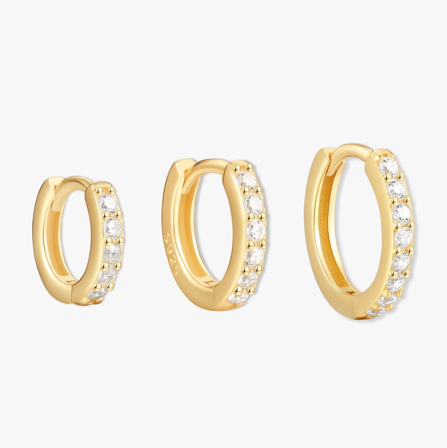 Gold hoop earrings with embedded stones on a white background