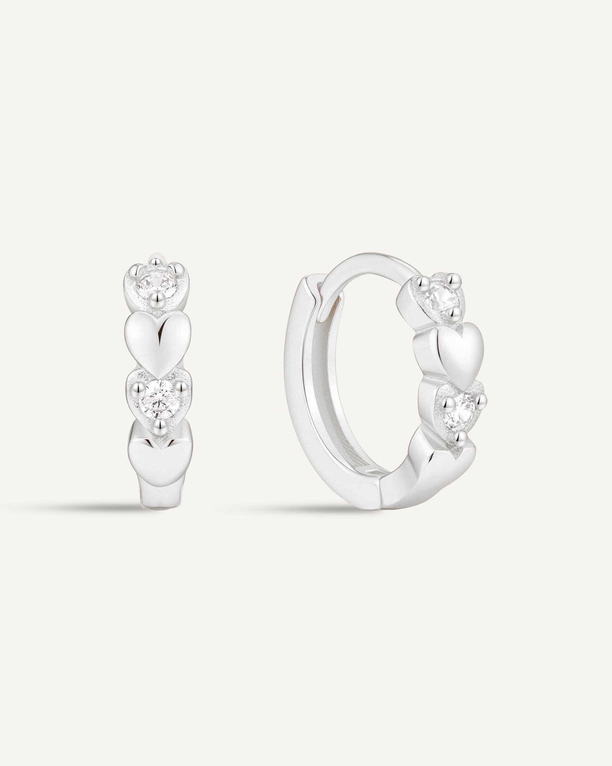 CZ Heart Huggie Hoops In Silver