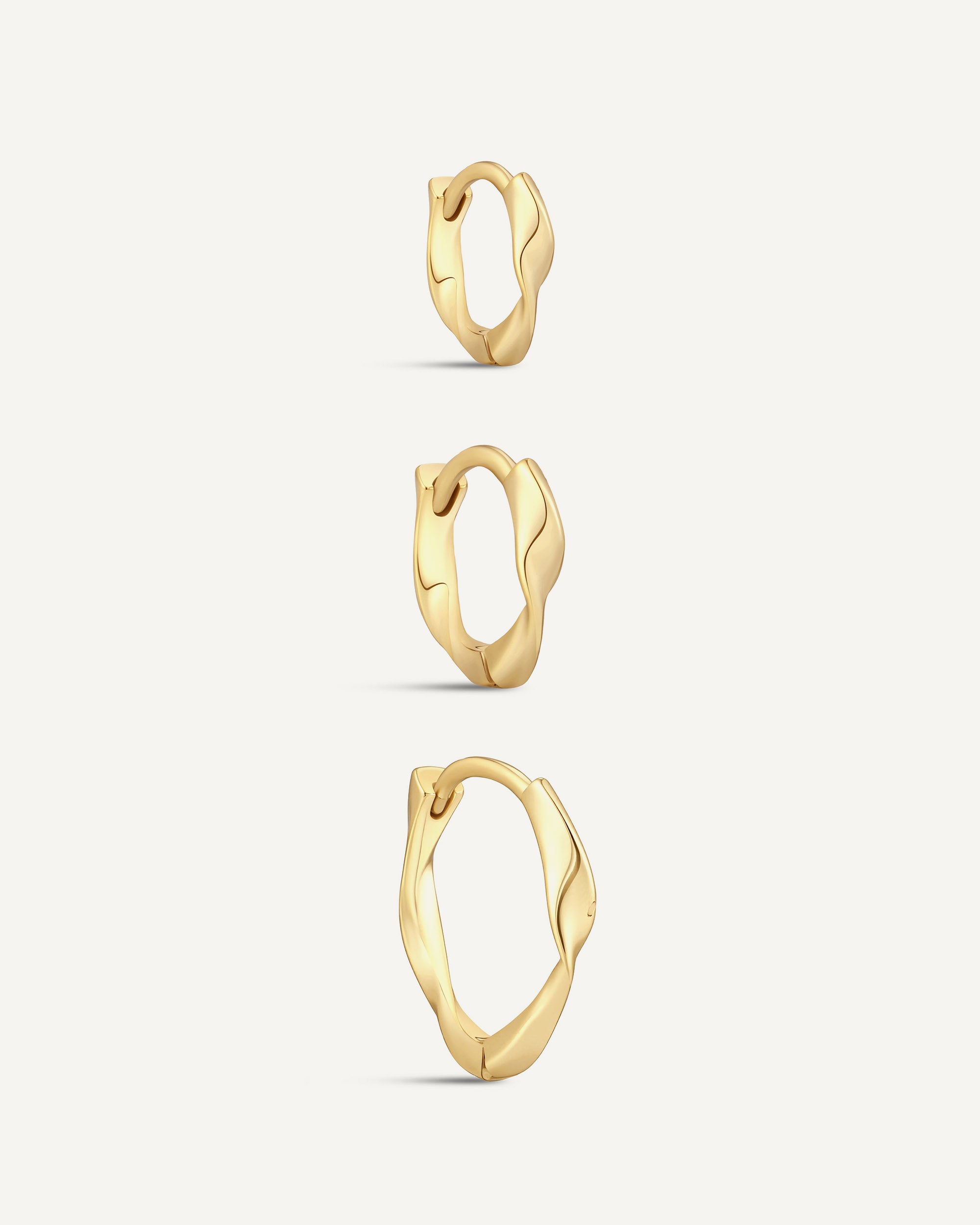 Twisted Huggie Hoops In Gold