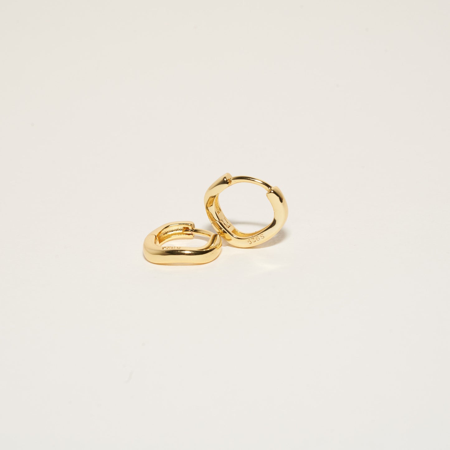 Sculpted Wavy Huggie Hoops In Gold