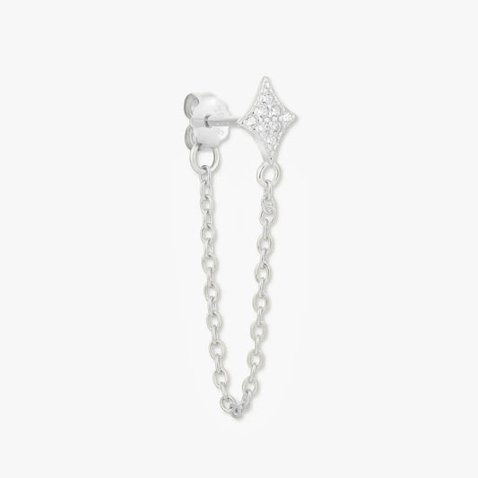 Silver earring with chain on a white background