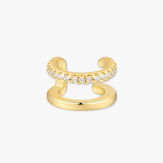 Gold open ear cuff with diamond accents on a white background