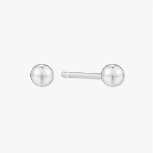 Pair of silver ball earrings on a white background