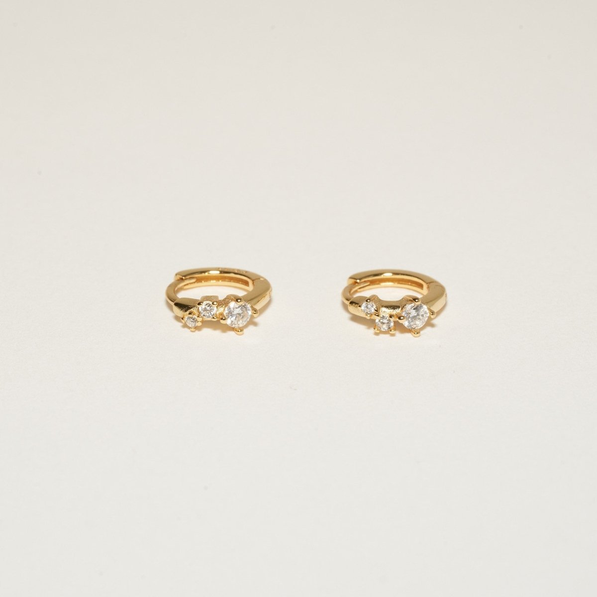 Sprinkle Crystal Huggie Hoops In Gold - LÉA