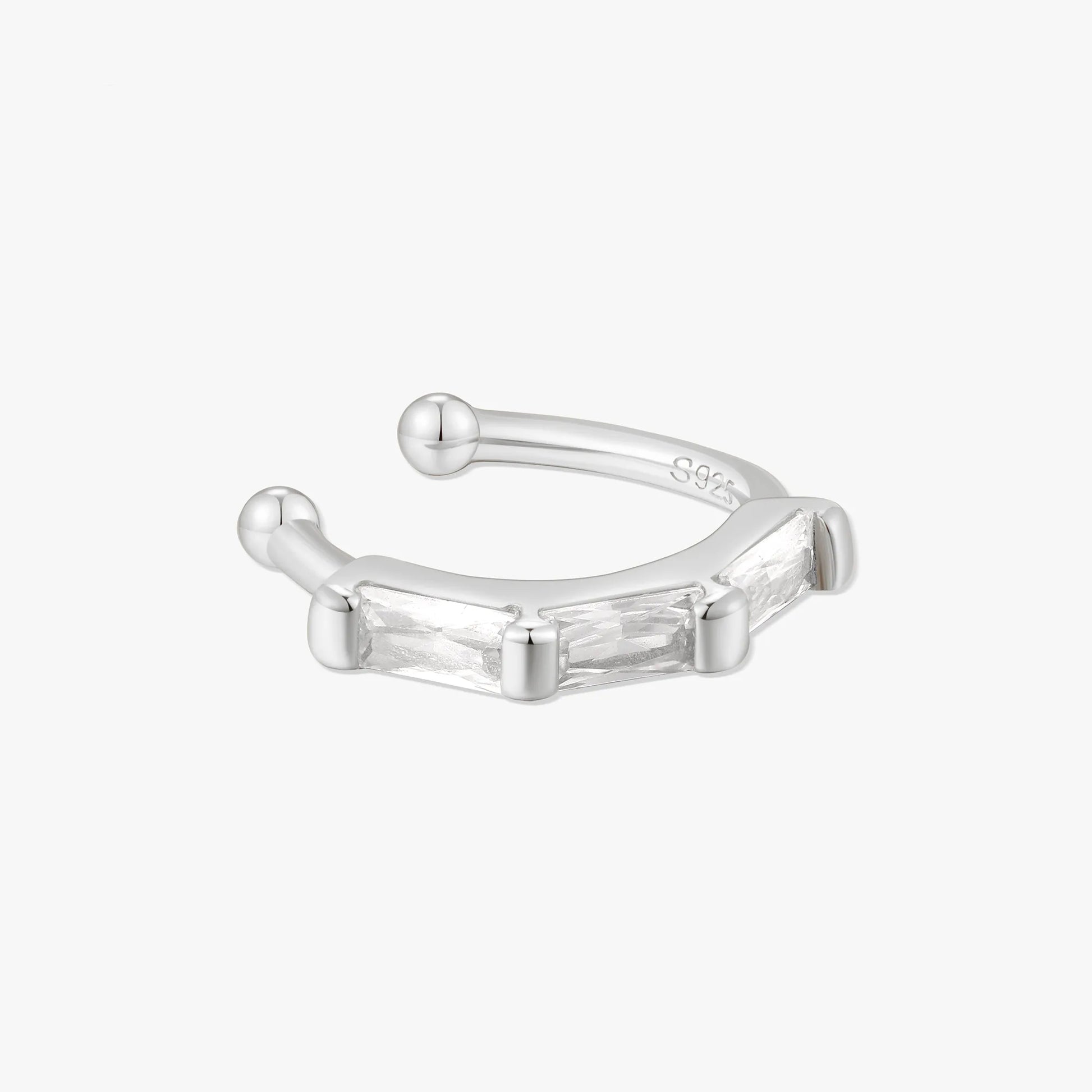 Silver ear cuff on a white background