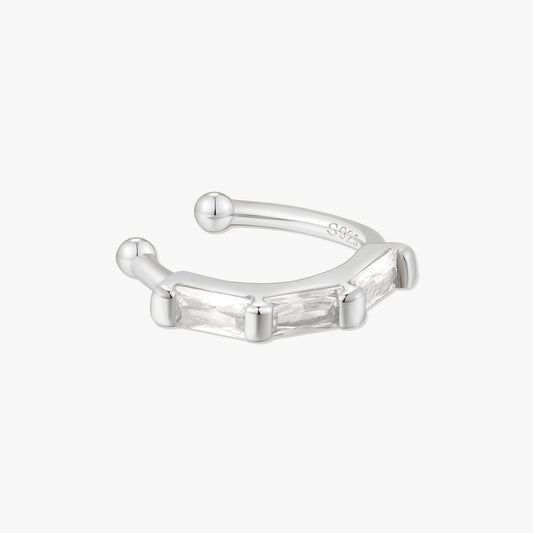Silver ear cuff on a white background