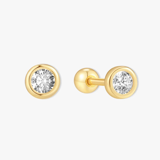Pair of gold stud earrings with clear gemstones on a white background