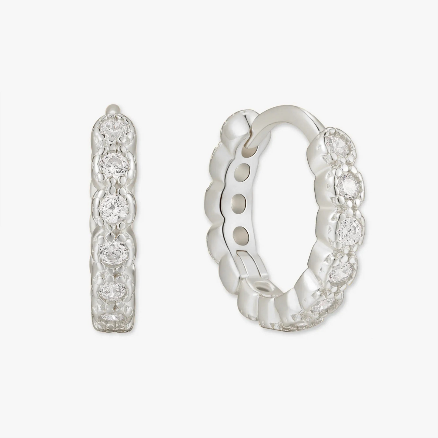 Silver hoop earrings with small diamonds on a white background