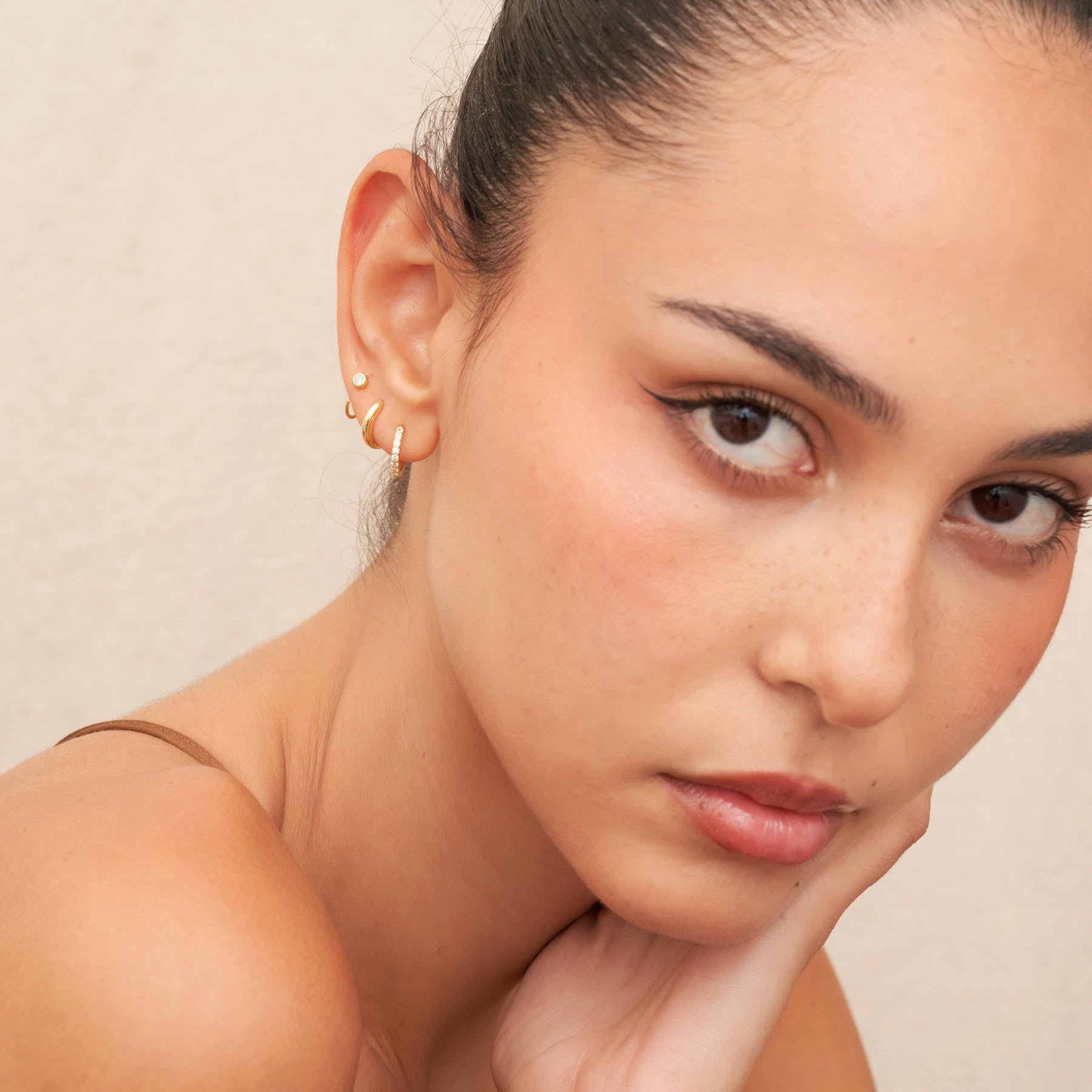 Close-up of a woman's face with a neutral background