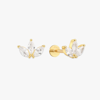 Gold and clear crystal earrings on a white background