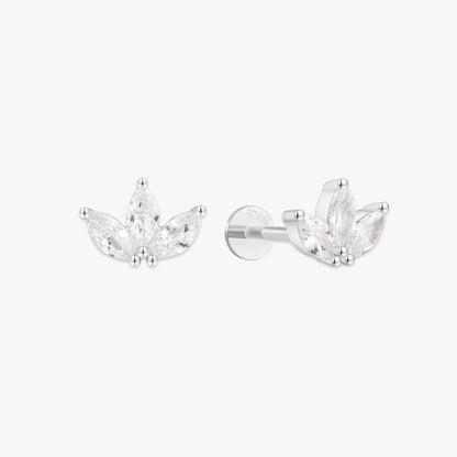 Pair of silver earrings with clear gemstones on a white background