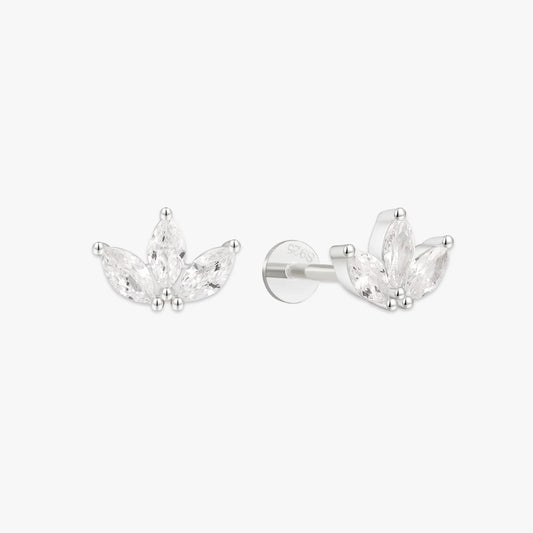 Pair of silver earrings with clear gemstones on a white background