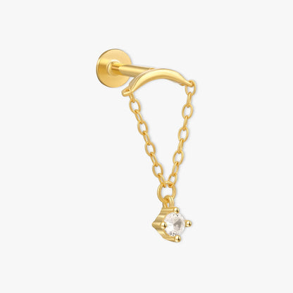 Gold earring with a chain and small diamond on a white background