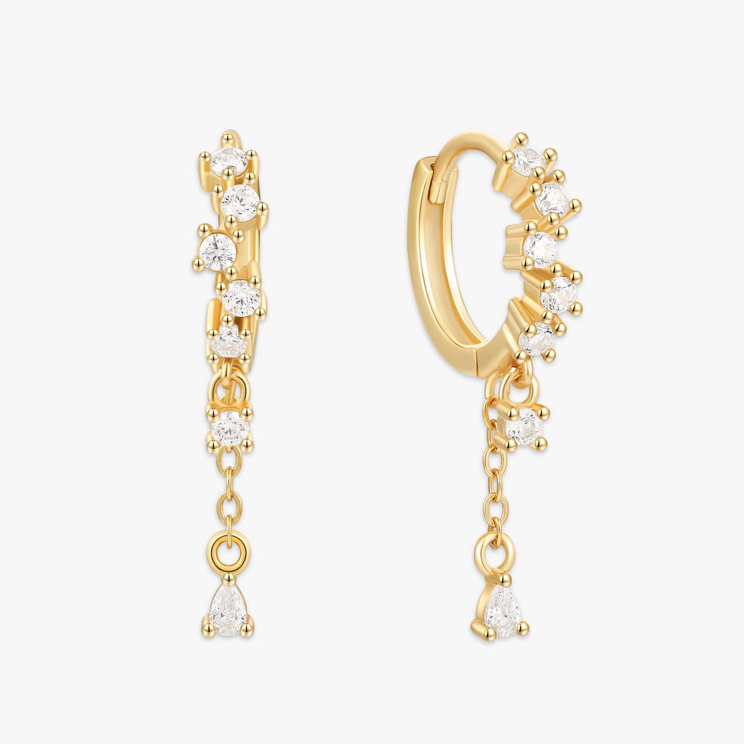 Gold hoop earrings with diamond-like stones on a white background