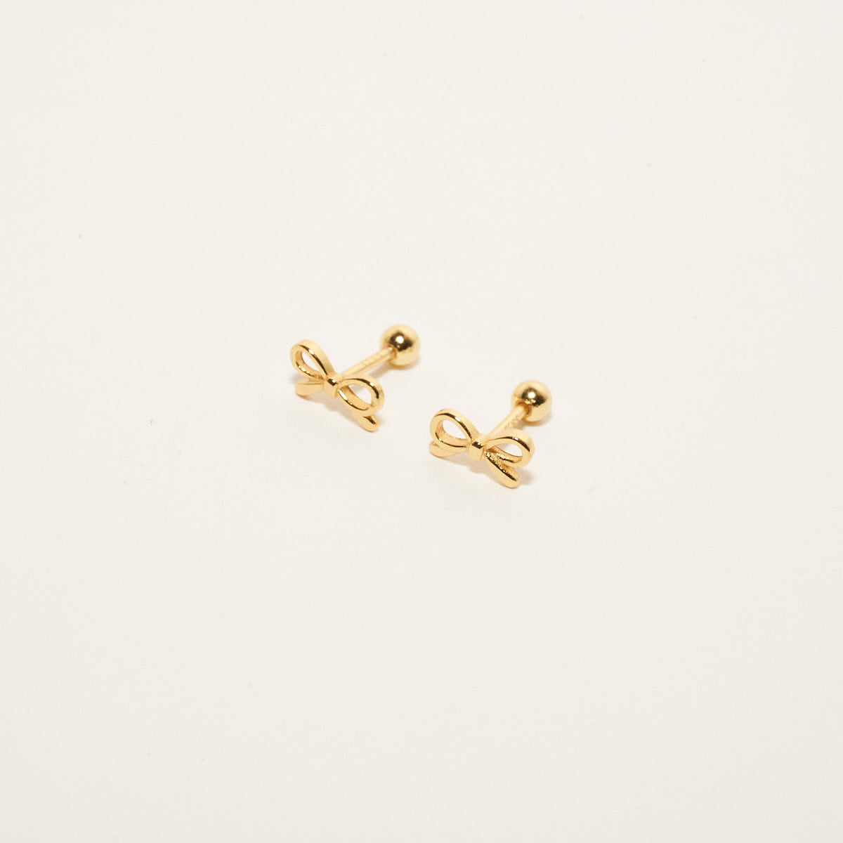 Chic Bow Barbell Studs In Gold