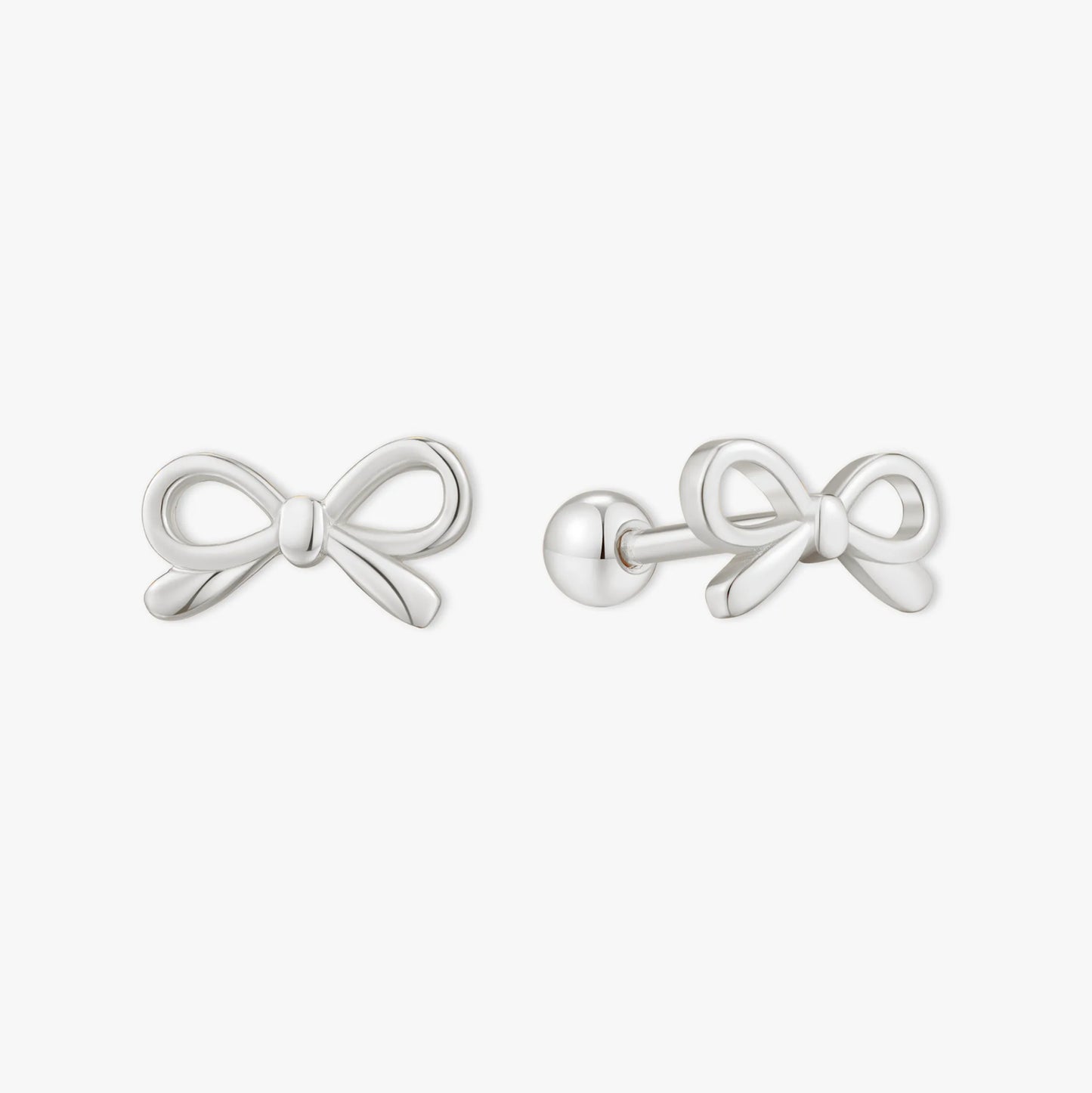 Silver bow-shaped earrings on a white background