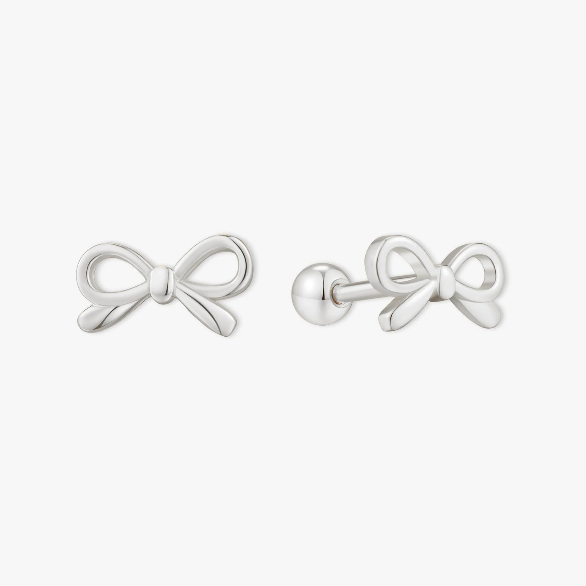Silver bow-shaped earrings on a white background