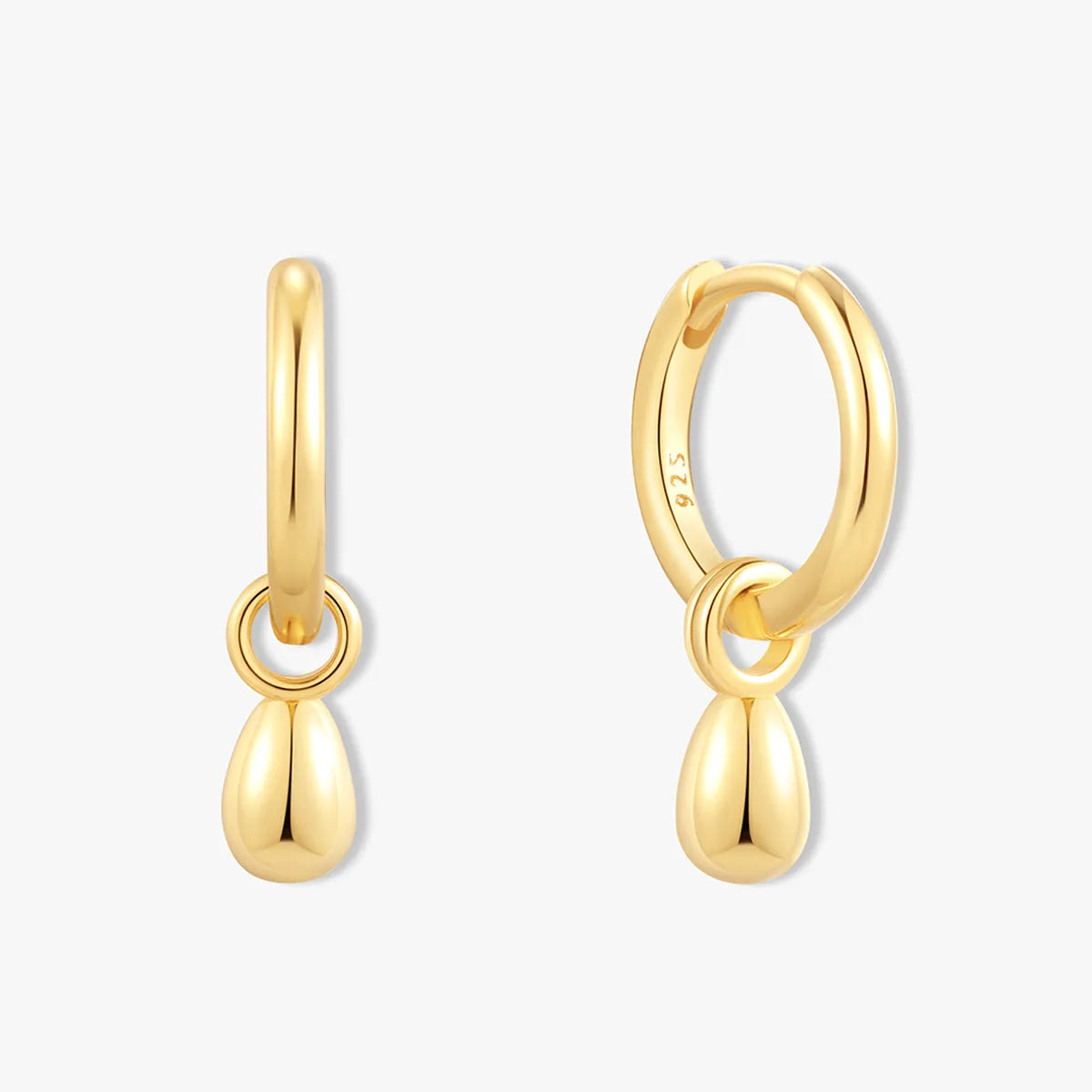 Gold hoop earrings with teardrop pendants on a white background