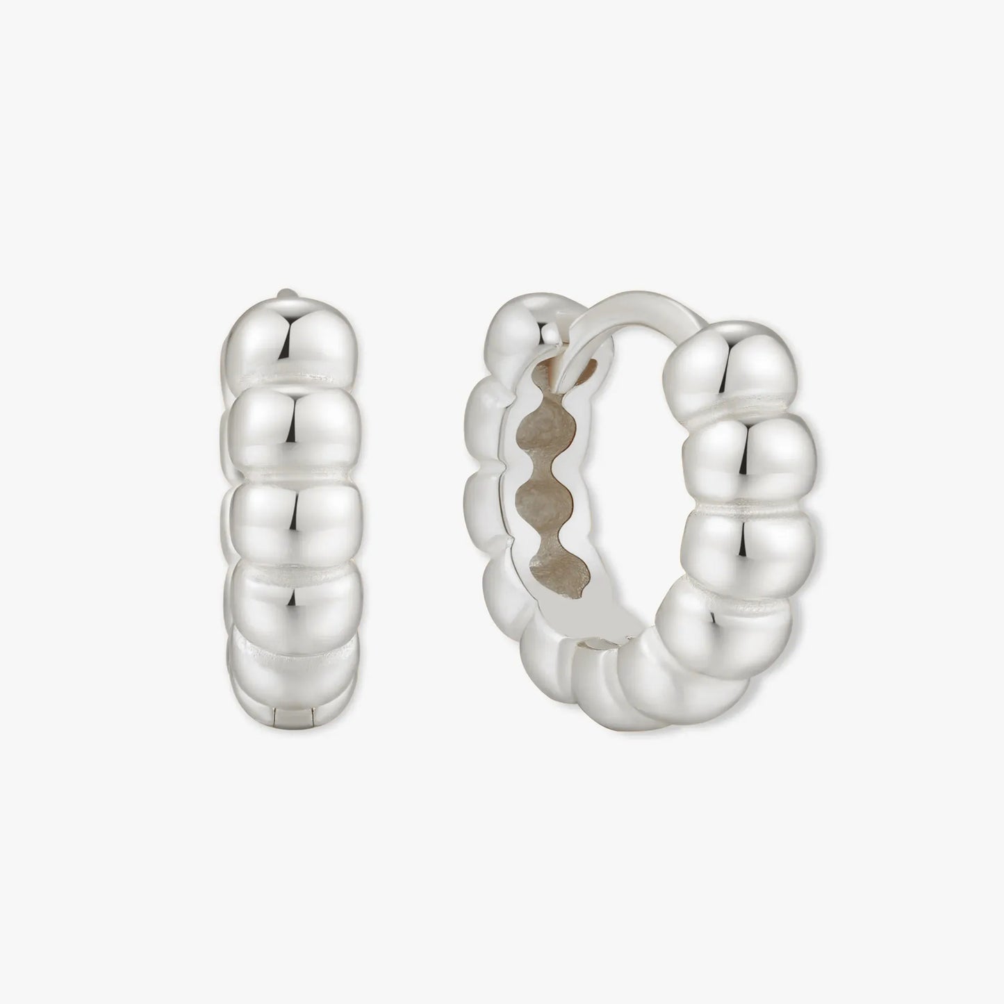 Silver hoop earrings on a white background