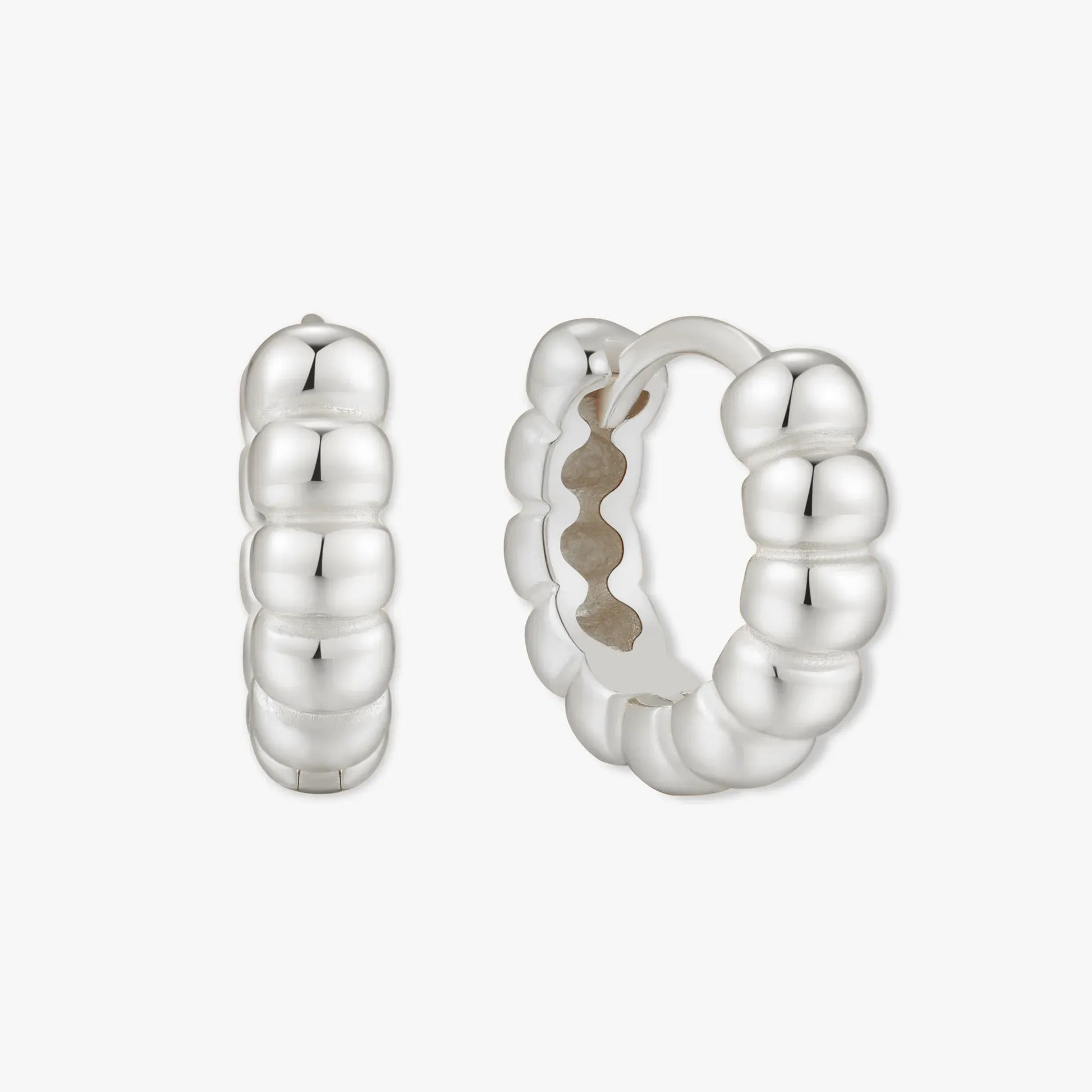 Silver hoop earrings on a white background