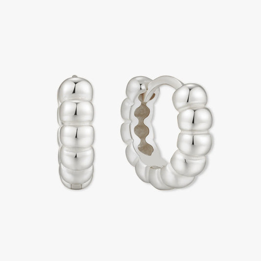 Silver hoop earrings on a white background