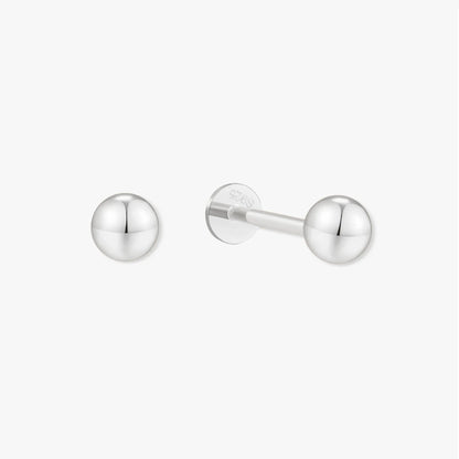 Pair of silver stud earrings on a white background