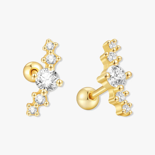 Gold earrings with clear gemstones on a white background