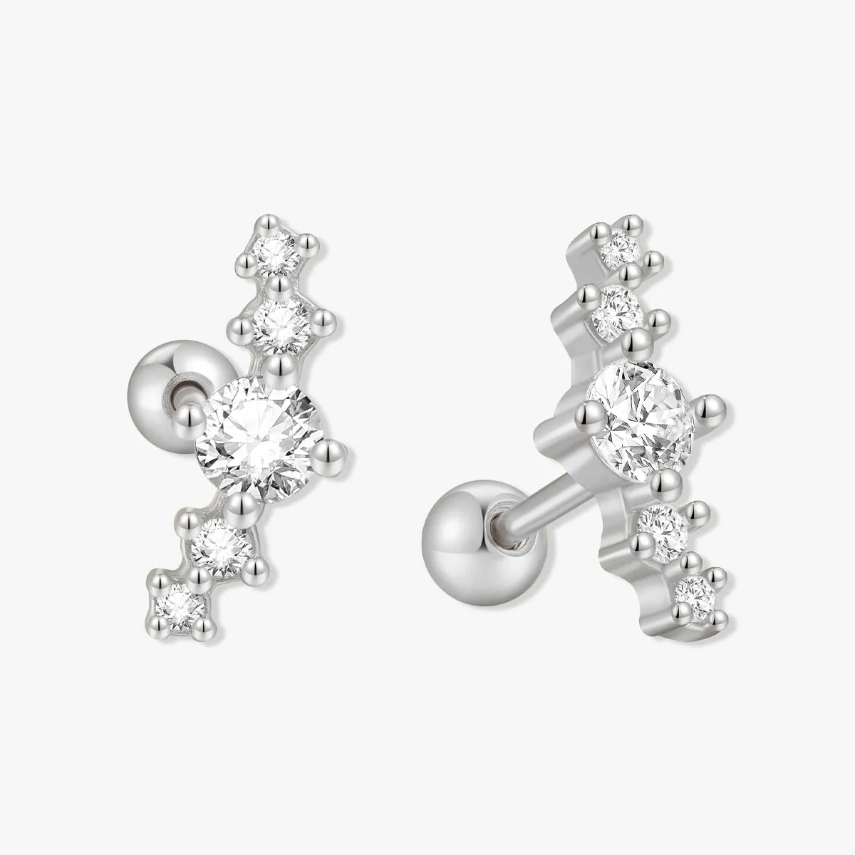 Silver earrings with clear gemstones on a white background