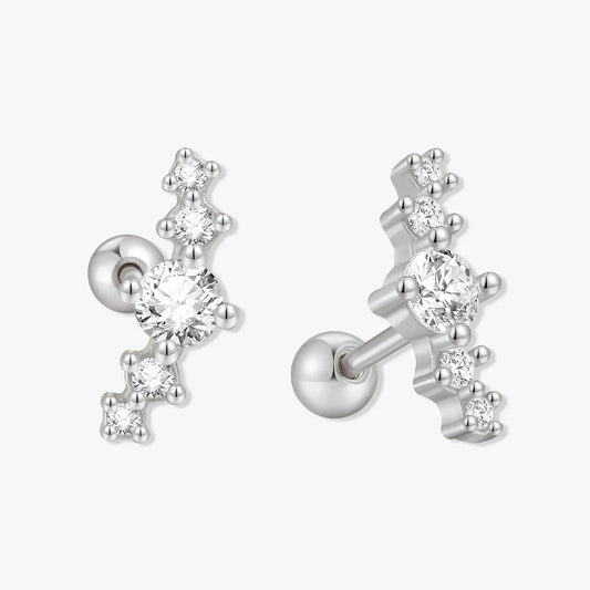 Silver earrings with clear gemstones on a white background