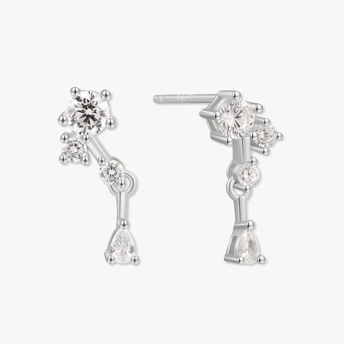 Silver earrings with clear gemstones on a white background