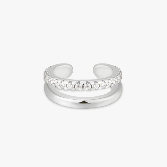 Silver ear cuff with clear gemstones on a white background