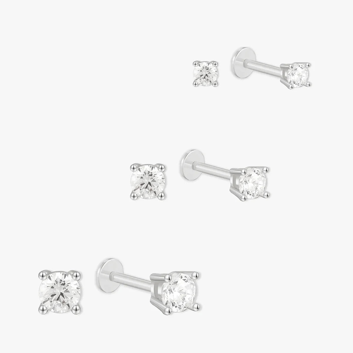 Set of diamond stud earrings on a white background