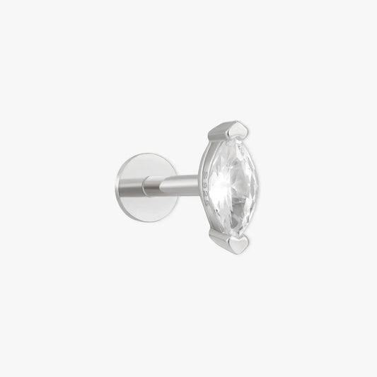 Silver earring with a clear gemstone on a white background