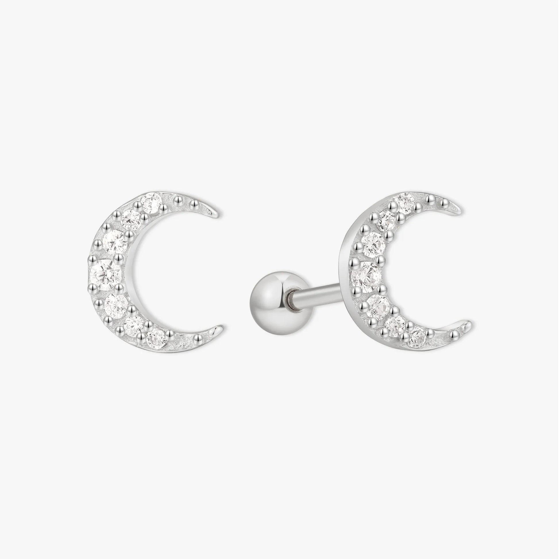 Silver crescent moon earrings on a white background