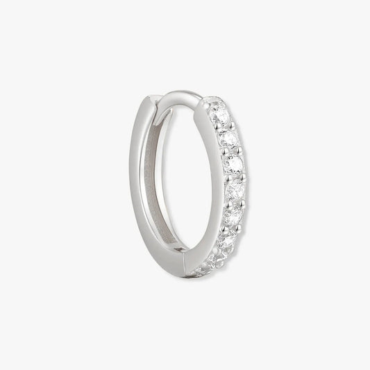 Silver hoop earring with embedded stones on a white background