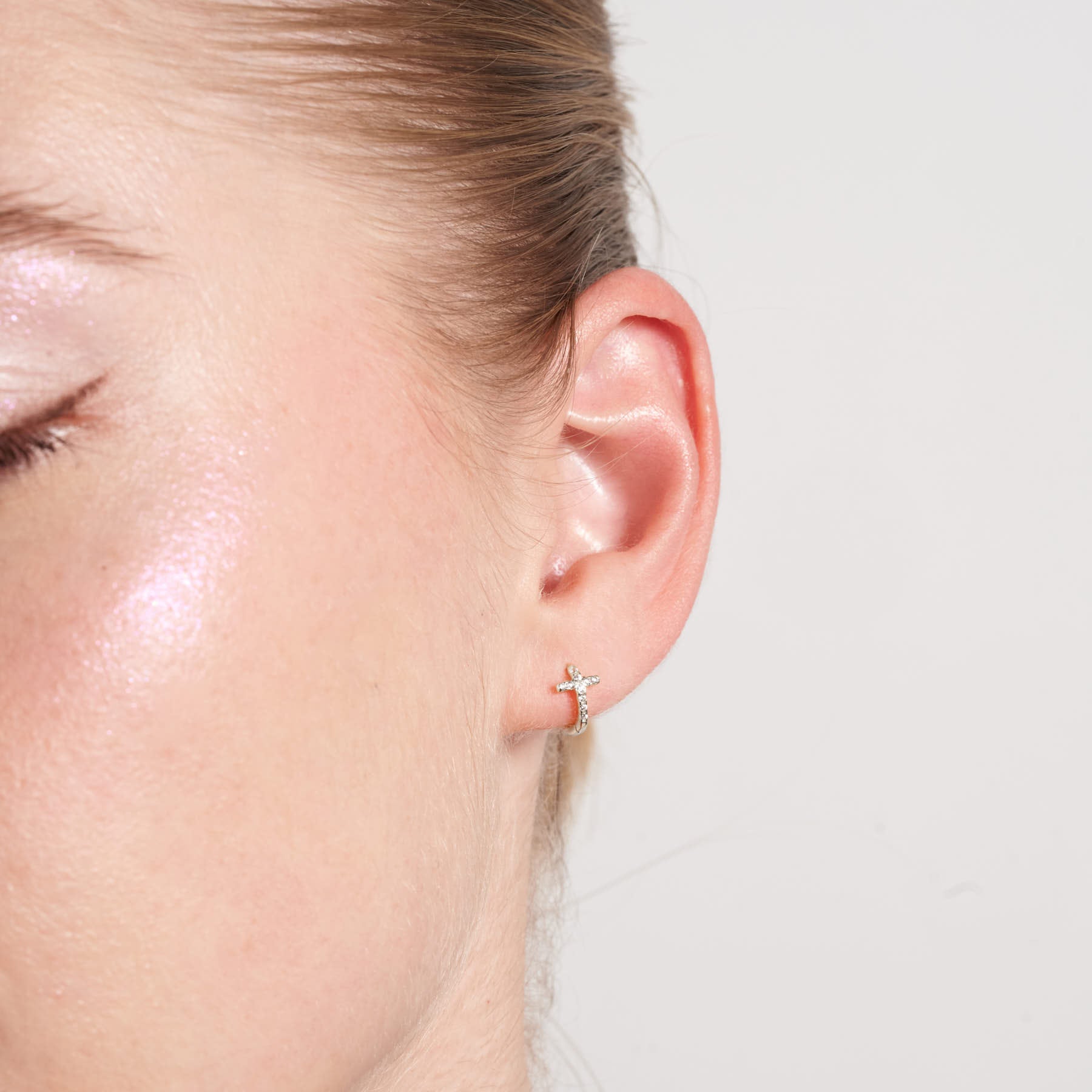 Crystal Paved Cross Huggie Hoops In Silver