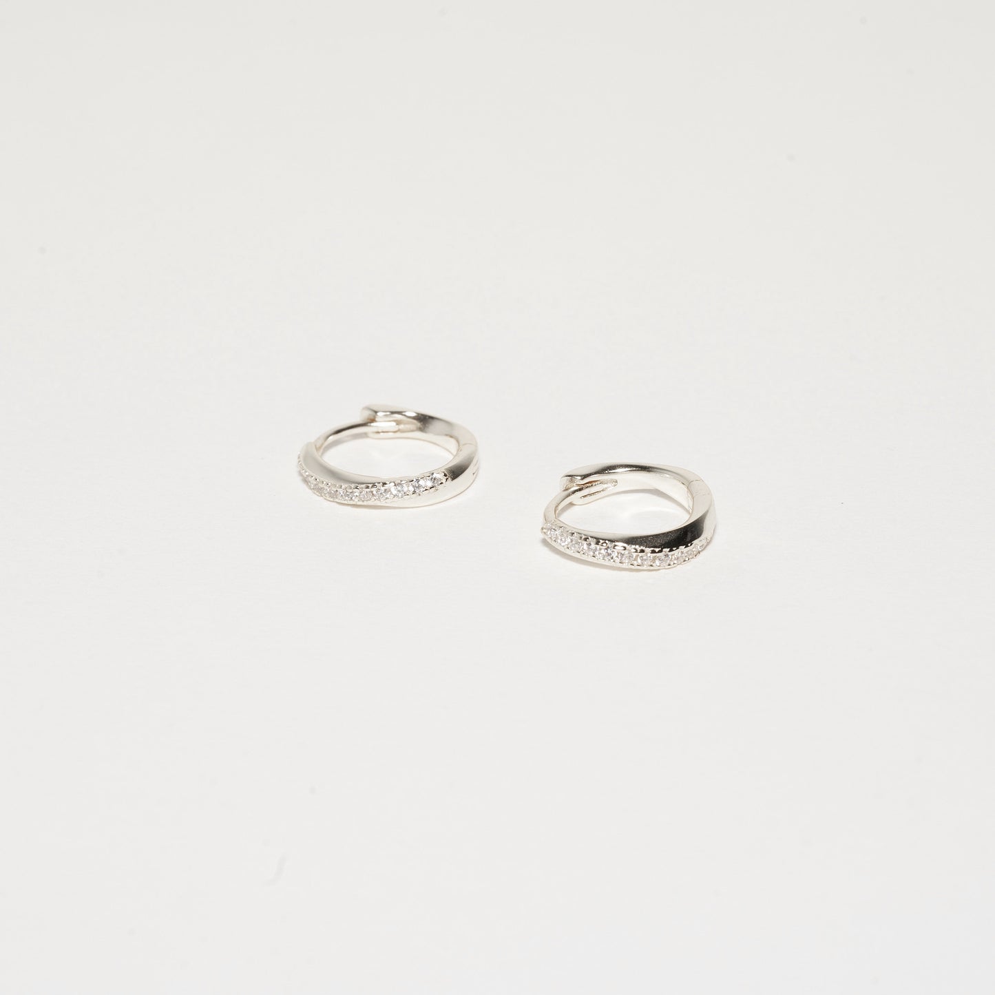 Crystal Paved Twisted Huggies in Silver