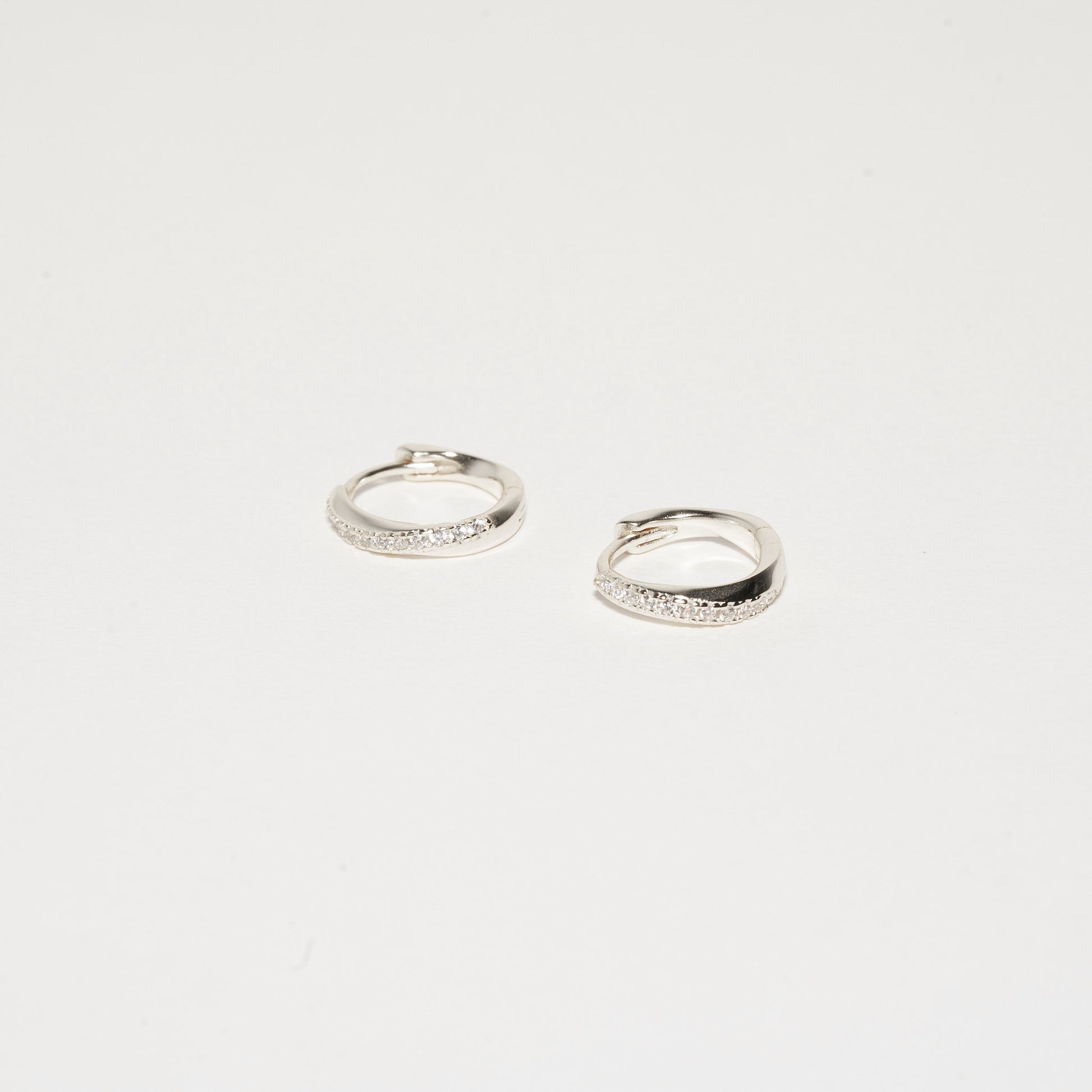 Crystal Paved Twisted Huggies in Silver