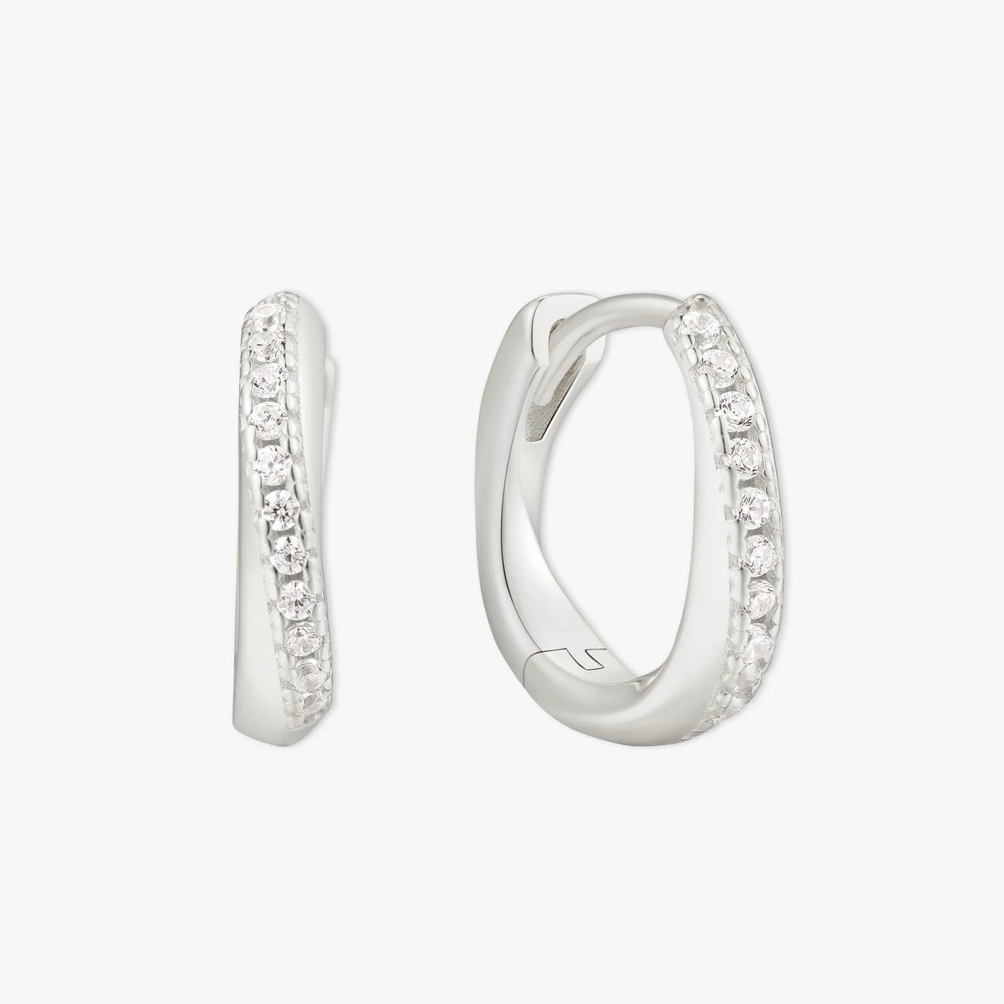 Silver hoop earrings with embedded stones on a white background