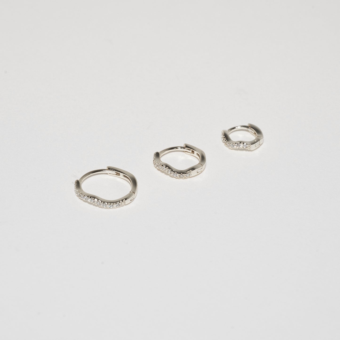 Crystal Paved Wavy Huggies Set in Silver