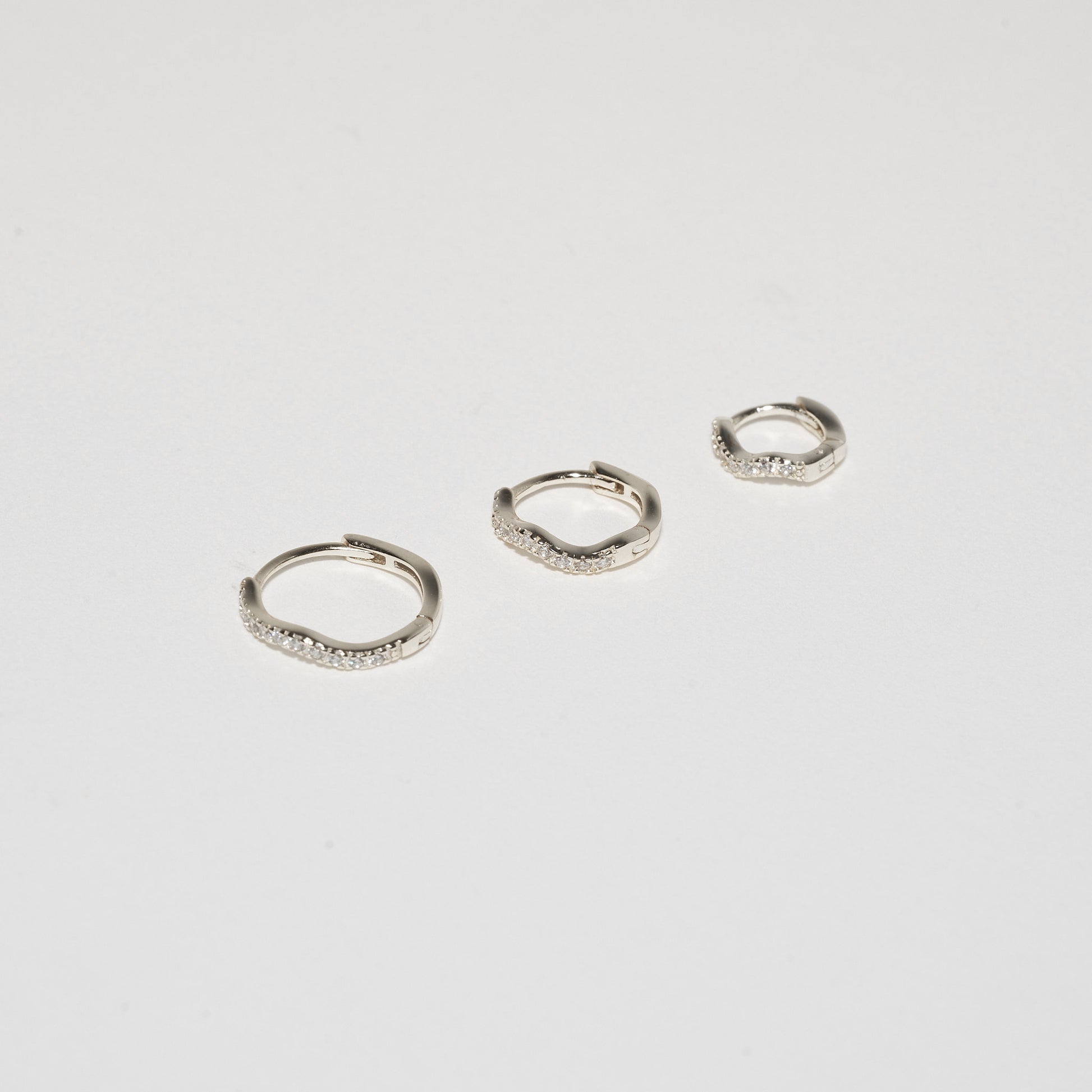 Crystal Paved Wavy Huggies Set in Silver