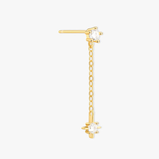 Gold earring with a chain and star-shaped design on a white background