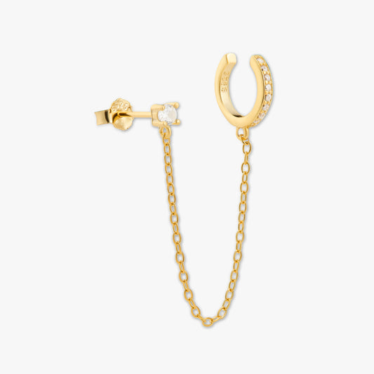 Gold hoop earring with chain on a white background