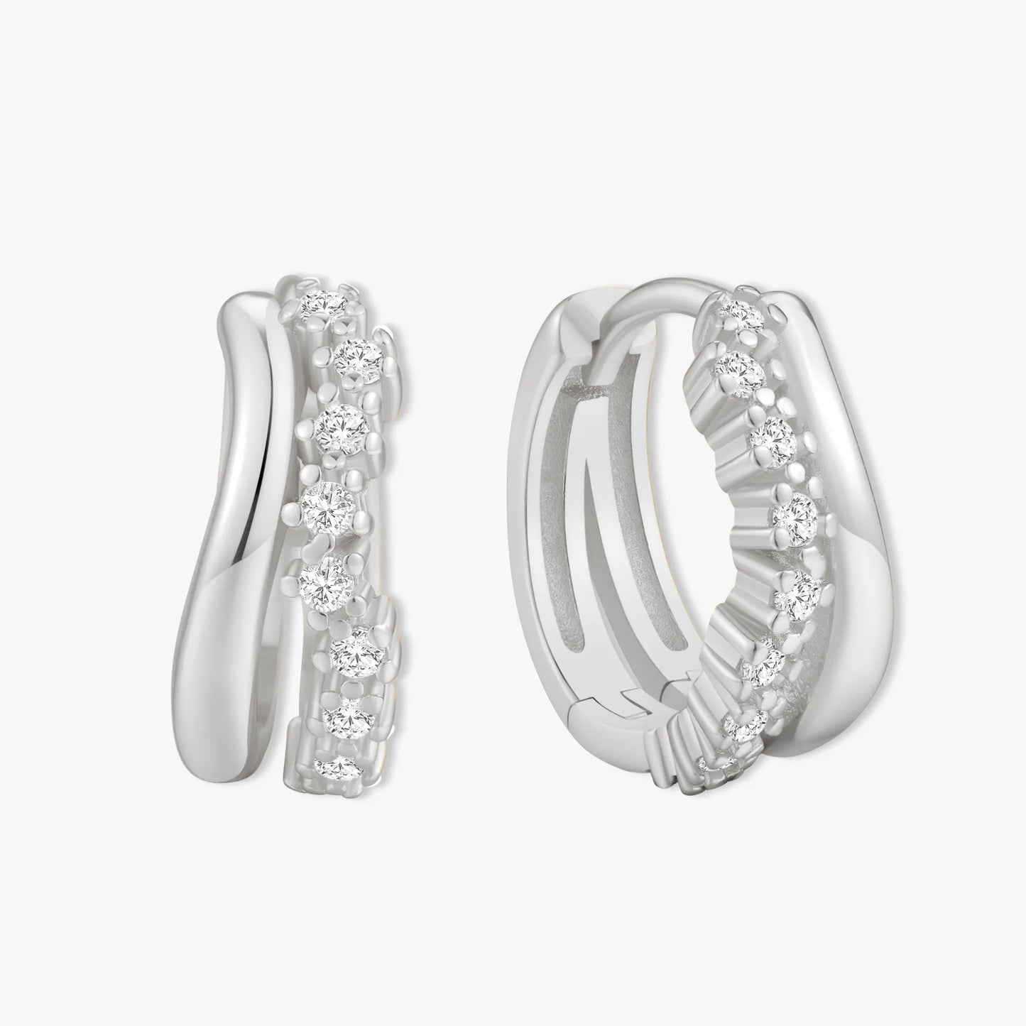 Silver hoop earrings with embedded stones on a white background