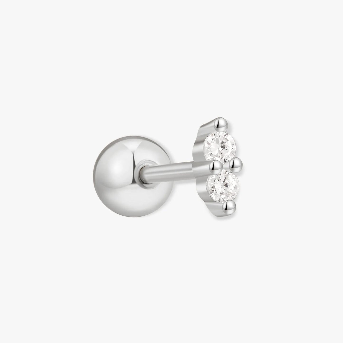 Silver stud earring with a small clear gemstone on a white background