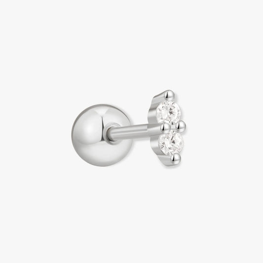 Silver stud earring with a small clear gemstone on a white background