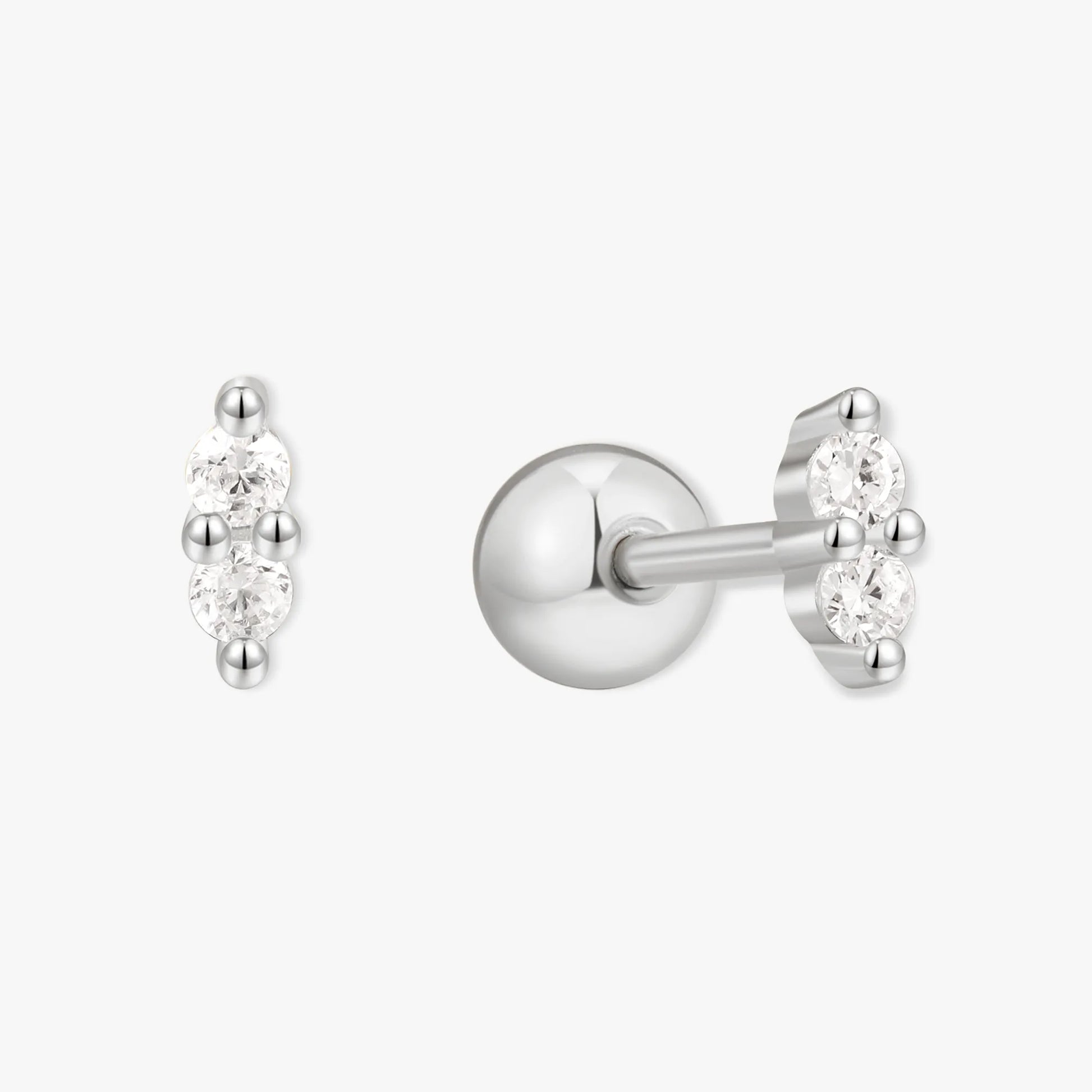 Silver stud earrings with clear gemstones on a white background