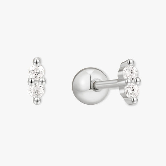 Silver stud earrings with clear gemstones on a white background