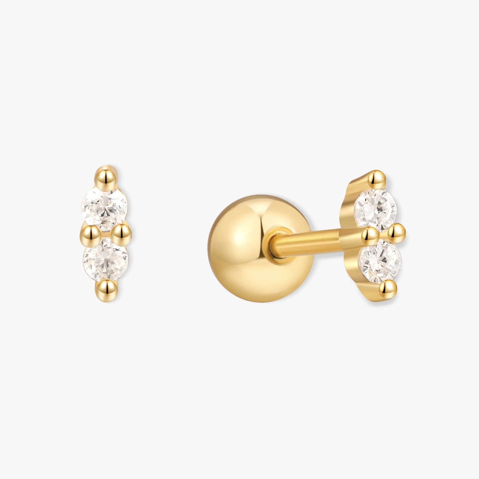 Gold earrings with small diamonds on a white background